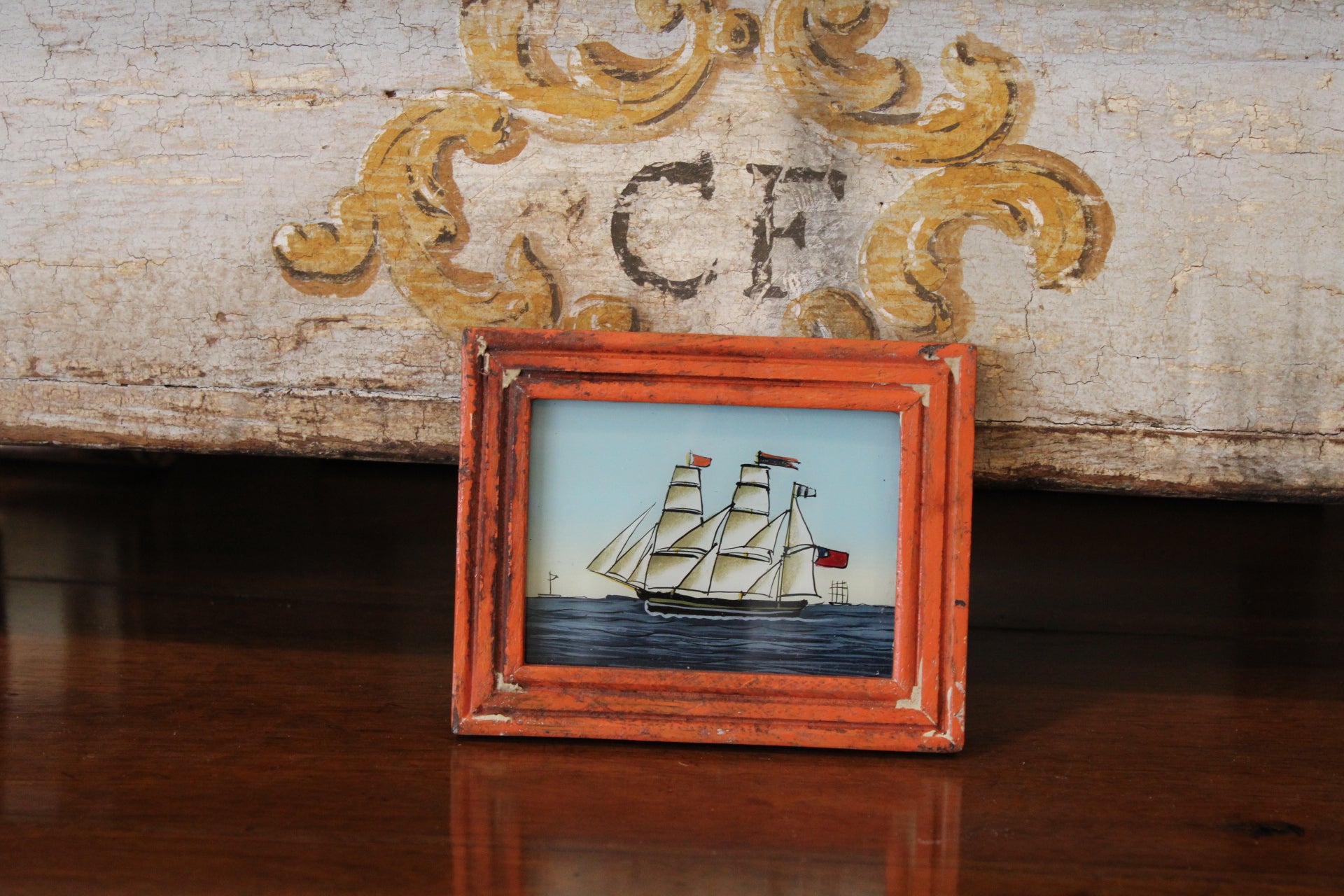 Vintage Reverse Glass Ship with Orange Frame