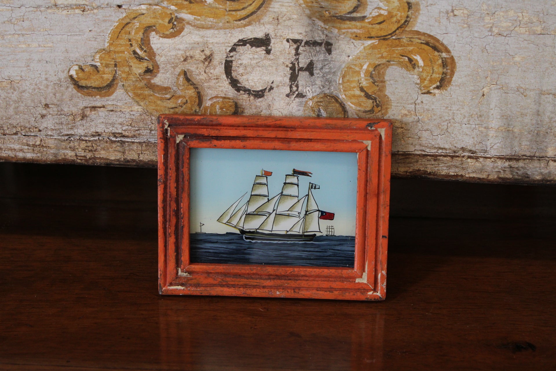 Vintage Reverse Glass Ship with Orange Frame