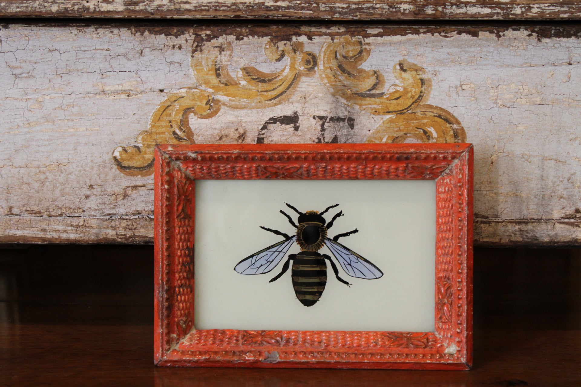 Vintage Reverse Glass Bee with Orange Frame